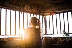 woman behind bars